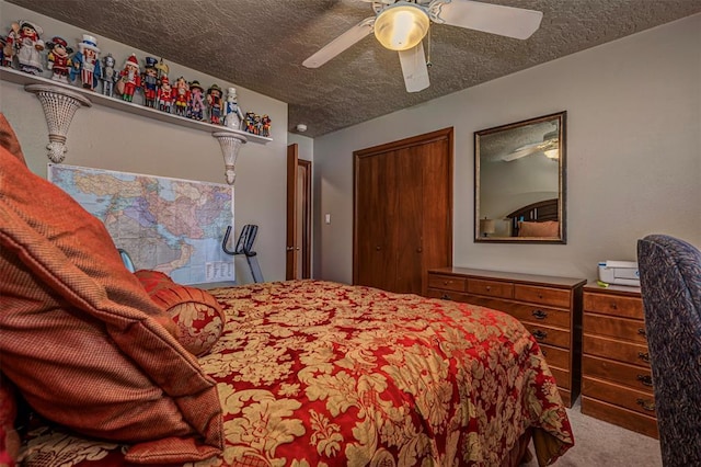 427 Foreman Ave, Norman, OK 73069 - bedroom featuring carpet, a textured ceiling, ceiling fan, and a closet