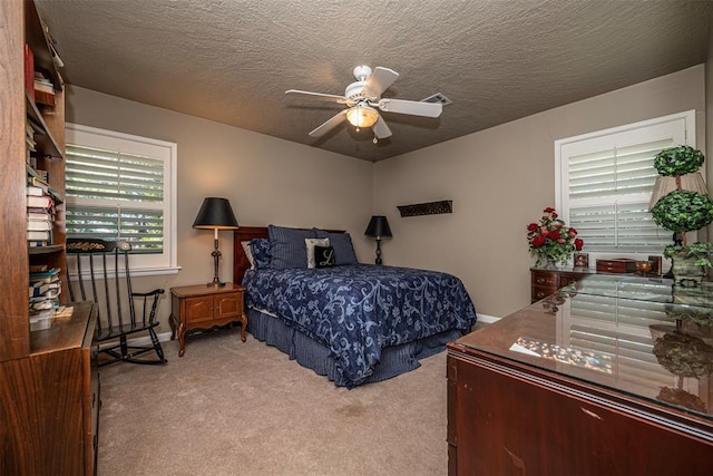 427 Foreman Ave, Norman, OK 73069 - carpeted bedroom with ceiling fan and a textured ceiling