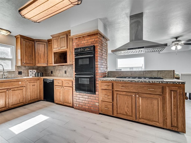 9290 N Hiwassee Rd, Jones, OK 73049 - kitchen with black appliances, island exhaust hood, plenty of natural light, and a ceiling fan