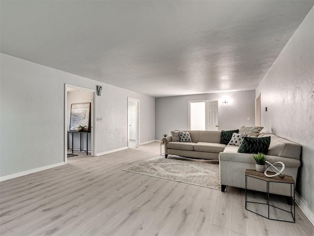 9290 N Hiwassee Rd, Jones, OK 73049 - living area featuring light wood-type flooring and baseboards
