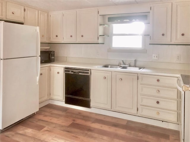 72 Lakeside Dr, Osage, OK 74054 - kitchen featuring black appliances, a sink, open shelves, light wood-style flooring, and light countertops