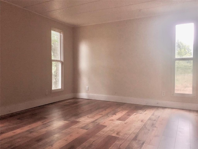 72 Lakeside Dr, Osage, OK 74054 - spare room with wood-type flooring and baseboards