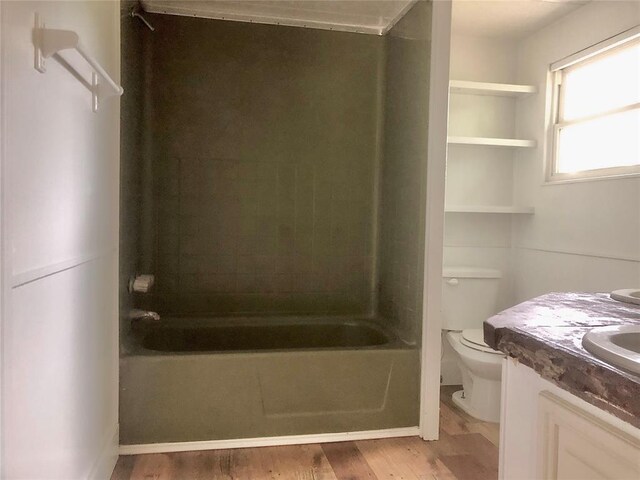 72 Lakeside Dr, Osage, OK 74054 - bathroom featuring wood finished floors, toilet, vanity, and shower / washtub combination