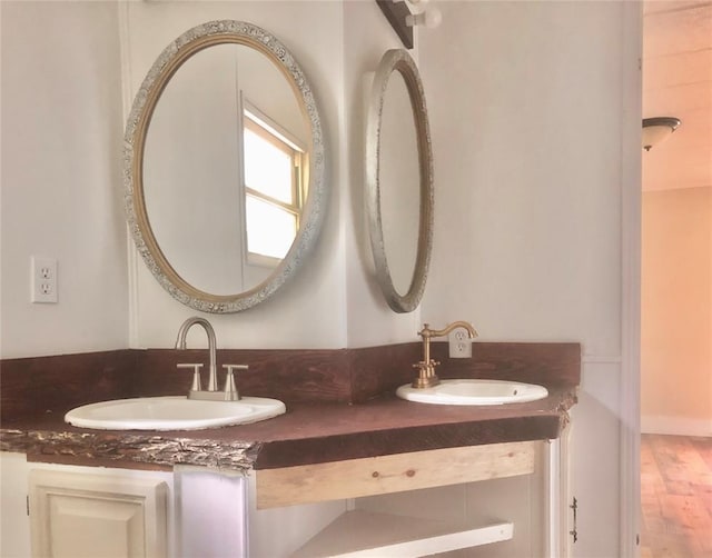 72 Lakeside Dr, Osage, OK 74054 - bathroom featuring double vanity and wood finished floors