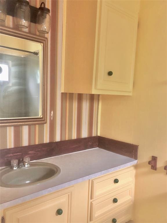 72 Lakeside Dr, Osage, OK 74054 - bathroom featuring wallpapered walls and vanity