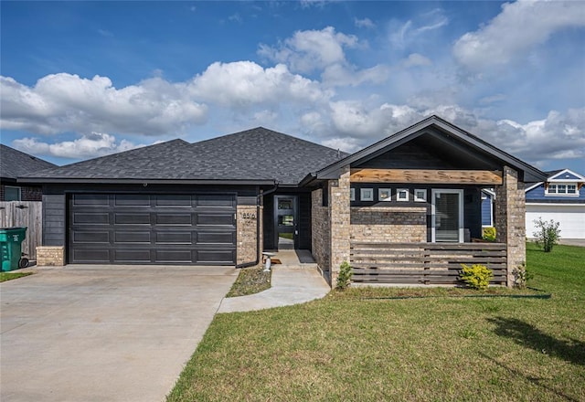 8516 Gibbs Dr, Oklahoma City, OK 73135 - view of front of house featuring a front yard, a garage, concrete driveway, a shingled roof, and brick siding