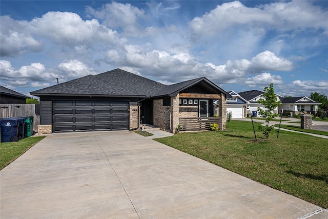 8516 Gibbs Dr, Oklahoma City, OK 73135 - ranch-style home featuring concrete driveway, a garage, brick siding, and roof with shingles