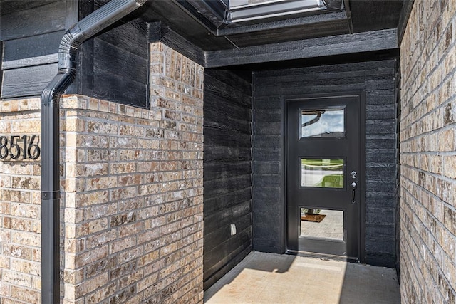 8516 Gibbs Dr, Oklahoma City, OK 73135 - view of exterior entry featuring brick siding