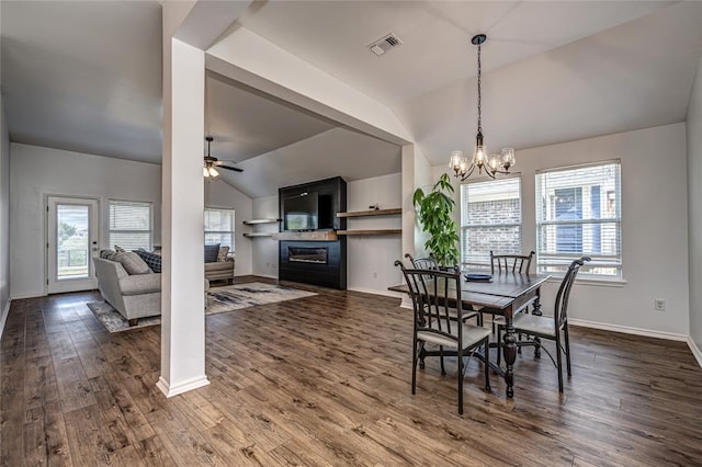 8516 Gibbs Dr, Oklahoma City, OK 73135 - dining room featuring vaulted ceiling, a glass covered fireplace, a ceiling fan, a chandelier, and baseboards
