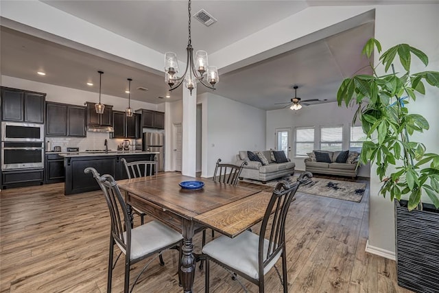 8516 Gibbs Dr, Oklahoma City, OK 73135 - dining space featuring ceiling fan, light wood-style flooring, a chandelier, baseboards, and recessed lighting