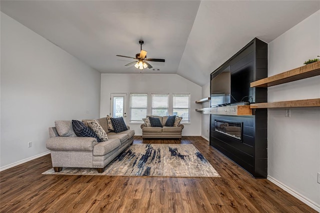 8516 Gibbs Dr, Oklahoma City, OK 73135 - living room with a ceiling fan, a glass covered fireplace, dark wood finished floors, baseboards, and lofted ceiling