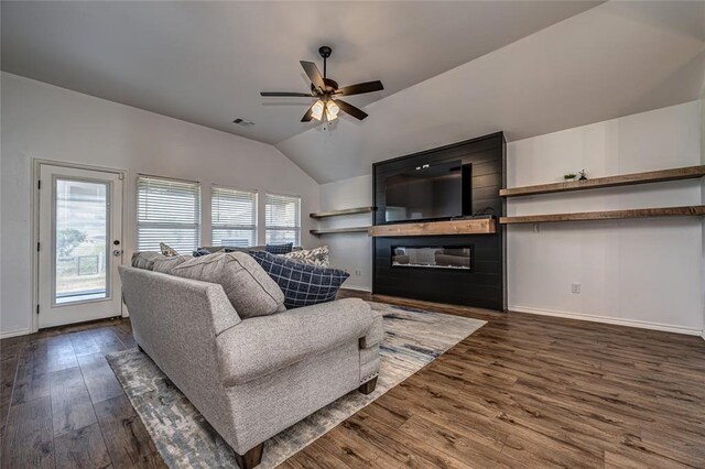 8516 Gibbs Dr, Oklahoma City, OK 73135 - living room with dark wood-style floors, lofted ceiling, a ceiling fan, baseboards, and a fireplace