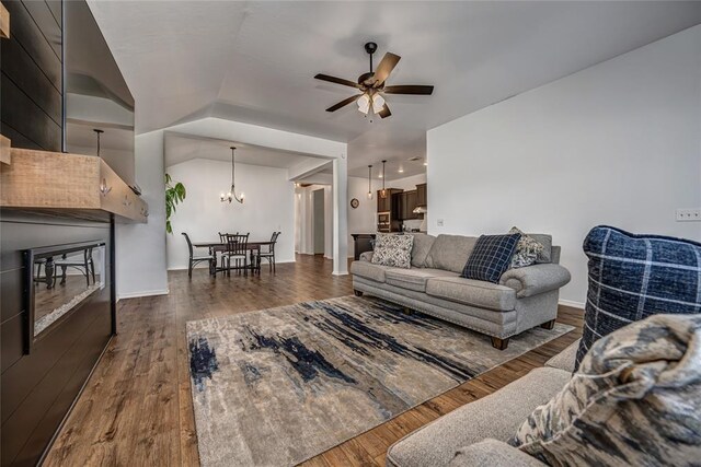 8516 Gibbs Dr, Oklahoma City, OK 73135 - living room with wood finished floors, ceiling fan, a chandelier, and baseboards
