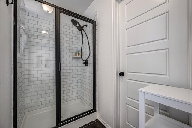 8516 Gibbs Dr, Oklahoma City, OK 73135 - bathroom with a stall shower and baseboards