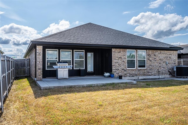 8516 Gibbs Dr, Oklahoma City, OK 73135 - rear view of house featuring central air condition unit, a patio area, and a shingled roof