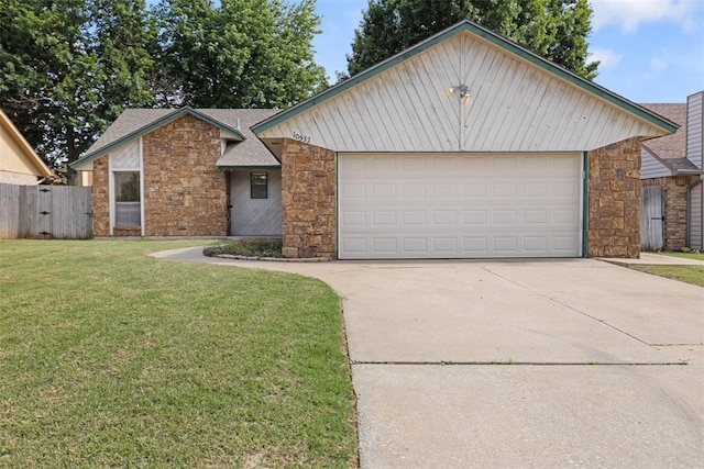 10532 Kristie Ln, Midwest City, OK 73130 - view of front of home with stone siding, concrete driveway, and roof with shingles