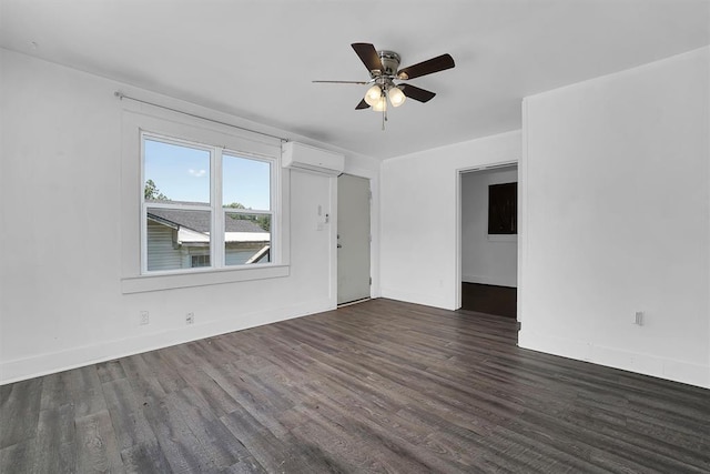815 Hayes Ave, Clinton, OK 73601 - unfurnished living room featuring a wall unit AC, dark wood finished floors, ceiling fan, and baseboards