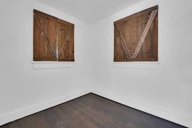 815 Hayes Ave, Clinton, OK 73601 - empty room with baseboards and dark wood-type flooring