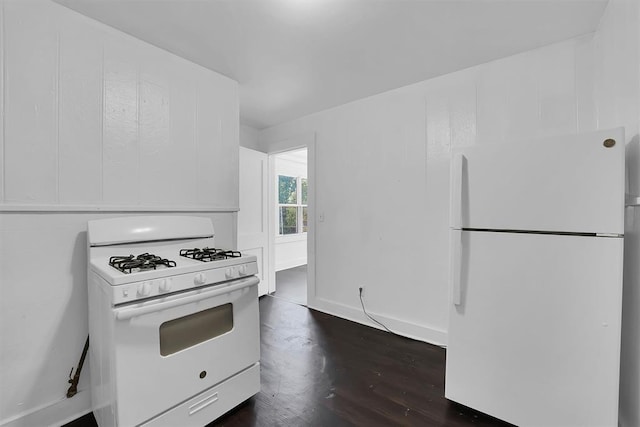815 Hayes Ave, Clinton, OK 73601 - kitchen with white appliances, white cabinets, and dark wood-style floors
