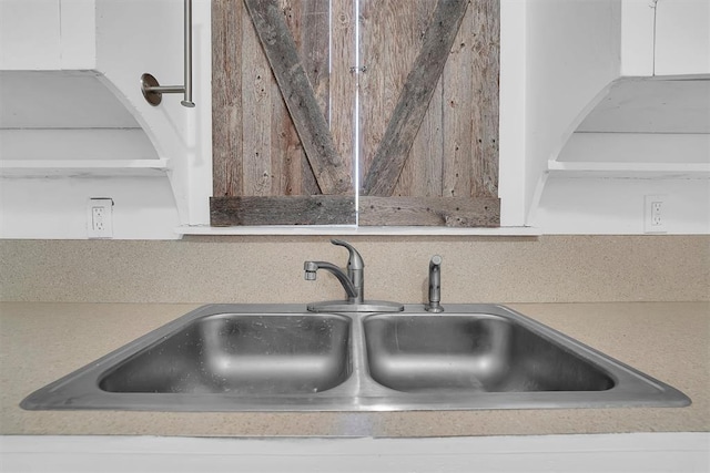 815 Hayes Ave, Clinton, OK 73601 - detailed view of a sink, open shelves, and white cabinetry