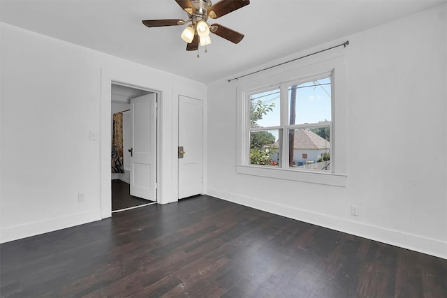 815 Hayes Ave, Clinton, OK 73601 - empty room with baseboards, dark wood finished floors, and ceiling fan