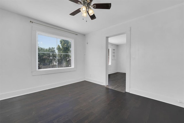 815 Hayes Ave, Clinton, OK 73601 - empty room with wood finished floors, baseboards, and ceiling fan
