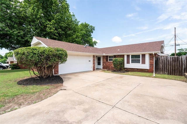 4333 NW 55th St, Oklahoma City, OK 73112 - ranch-style home featuring brick siding, driveway, and a garage