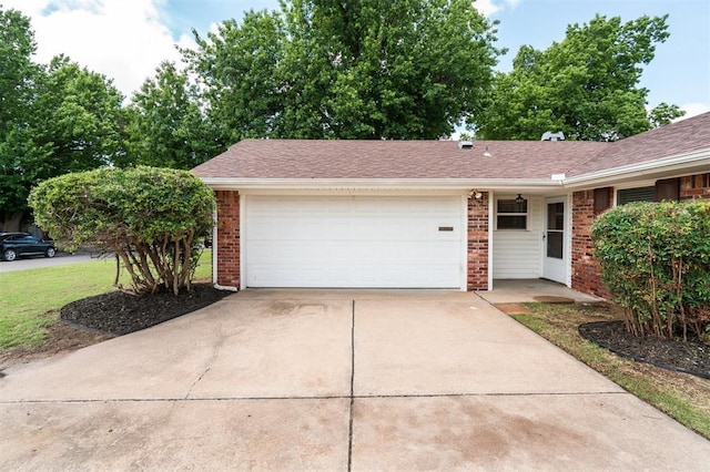 4333 NW 55th St, Oklahoma City, OK 73112 - ranch-style house featuring brick siding, an attached garage, concrete driveway, and a shingled roof