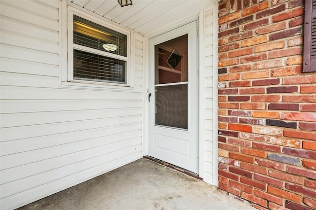 4333 NW 55th St, Oklahoma City, OK 73112 - doorway to property with brick siding
