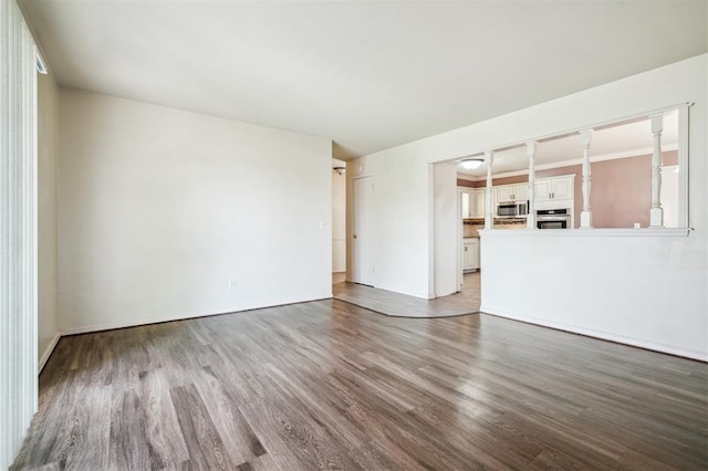 4333 NW 55th St, Oklahoma City, OK 73112 - spare room with wood finished floors and baseboards