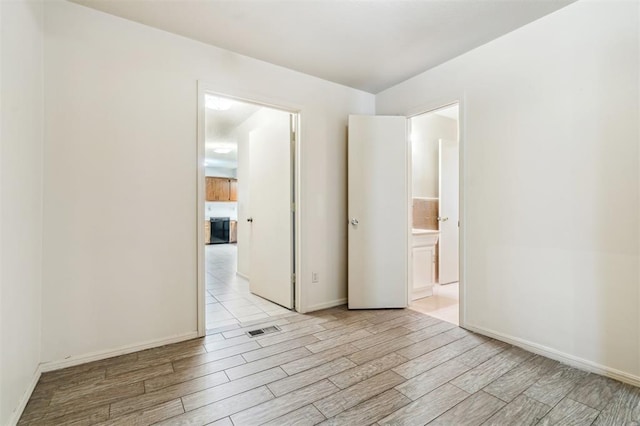 4333 NW 55th St, Oklahoma City, OK 73112 - unfurnished room featuring wood finished floors and baseboards