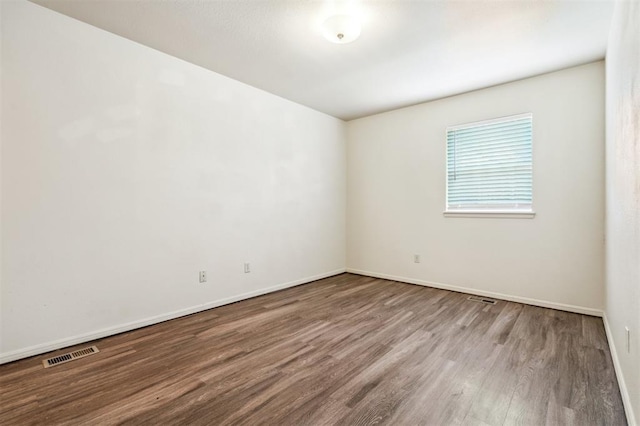 4333 NW 55th St, Oklahoma City, OK 73112 - spare room with wood finished floors and baseboards