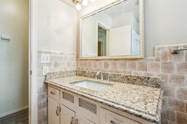 4333 NW 55th St, Oklahoma City, OK 73112 - bathroom featuring vanity, baseboards, and wood finished floors