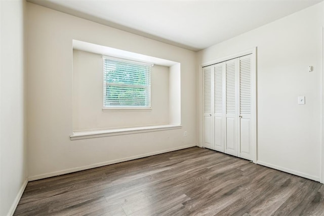 4333 NW 55th St, Oklahoma City, OK 73112 - unfurnished bedroom featuring wood finished floors, a closet, and baseboards