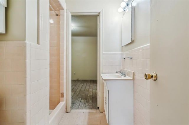 4333 NW 55th St, Oklahoma City, OK 73112 - bathroom featuring tile walls, vanity, and wainscoting