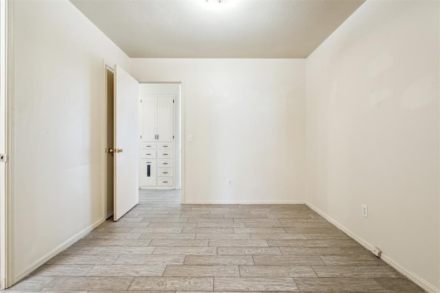 4333 NW 55th St, Oklahoma City, OK 73112 - empty room with light wood-style floors and baseboards