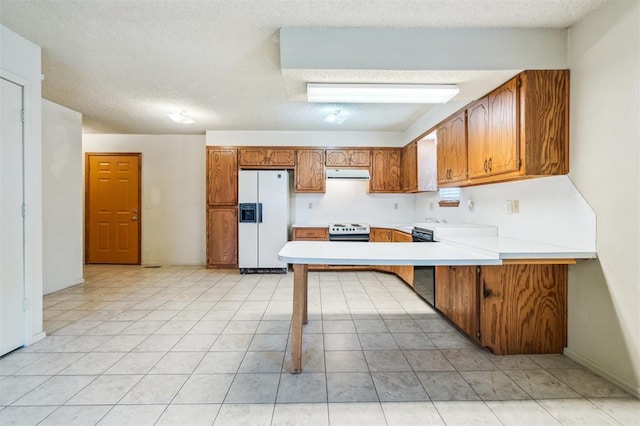4333 NW 55th St, Oklahoma City, OK 73112 - kitchen featuring white appliances, range hood, brown cabinetry, a peninsula, and a textured ceiling