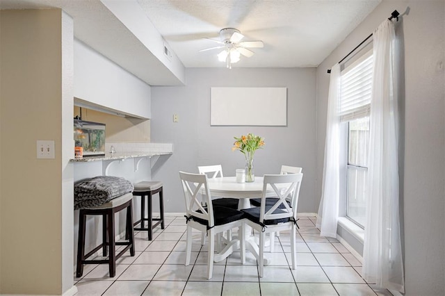 809 Cardinal Creek Blvd, Norman, OK 73072 - dining area with a ceiling fan, light tile patterned floors, and baseboards