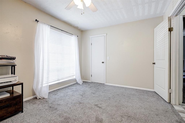 809 Cardinal Creek Blvd, Norman, OK 73072 - unfurnished bedroom with carpet floors, baseboards, and a ceiling fan