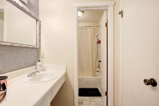 809 Cardinal Creek Blvd, Norman, OK 73072 - bathroom featuring shower / bath combination with curtain, vanity, and a textured ceiling