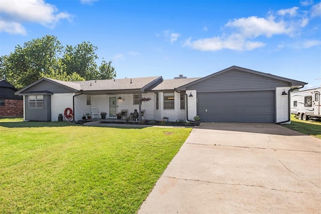 16 Clark Cir, Shawnee, OK 74804 - ranch-style house featuring brick siding, a front lawn, driveway, and an attached garage