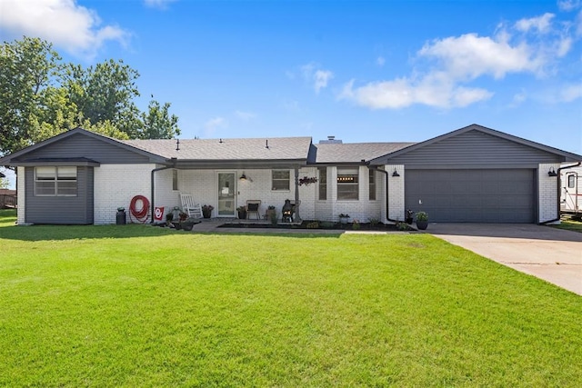 16 Clark Cir, Shawnee, OK 74804 - back of house featuring concrete driveway, brick siding, and an attached garage