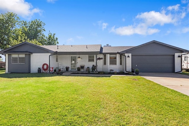 16 Clark Cir, Shawnee, OK 74804 - view of front of home with brick siding, driveway, and an attached garage