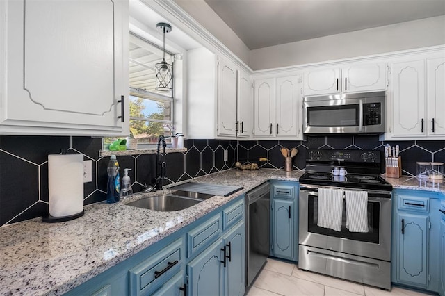 16 Clark Cir, Shawnee, OK 74804 - kitchen with stainless steel appliances, blue cabinets, a sink, and white cabinetry