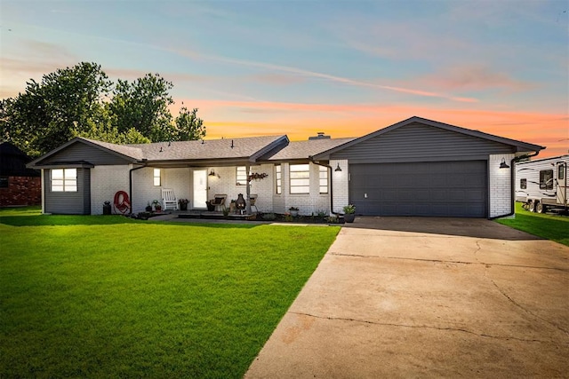 16 Clark Cir, Shawnee, OK 74804 - ranch-style home featuring a yard, a garage, and brick siding