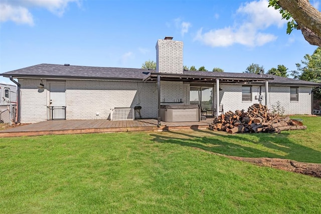 16 Clark Cir, Shawnee, OK 74804 - back of house featuring a hot tub, a chimney, brick siding, a deck, and a lawn