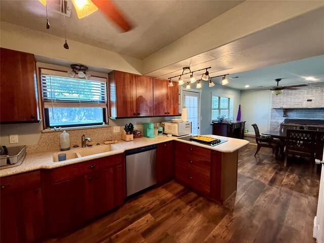 1000 Winnipeg Dr, Yukon, OK 73099 - kitchen featuring stainless steel dishwasher, a sink, a peninsula, light countertops, and dark wood finished floors