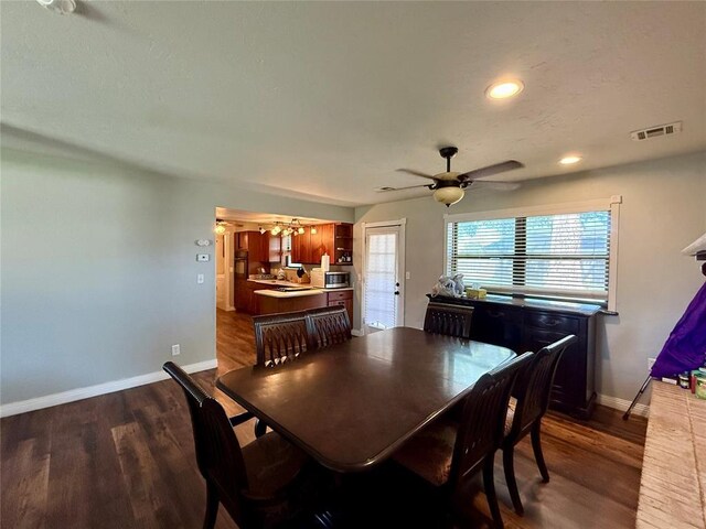 1000 Winnipeg Dr, Yukon, OK 73099 - dining space featuring baseboards, dark wood-type flooring, a chandelier, ceiling fan, and recessed lighting