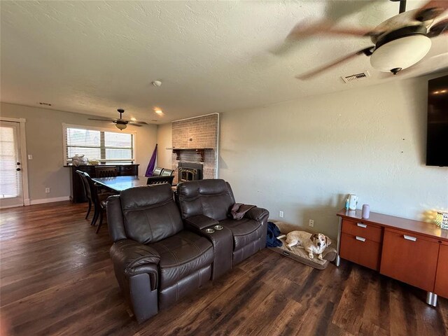 1000 Winnipeg Dr, Yukon, OK 73099 - living area with ceiling fan, wood finished floors, a brick fireplace, and baseboards