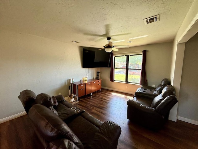 1000 Winnipeg Dr, Yukon, OK 73099 - living area with a textured ceiling, a ceiling fan, wood finished floors, and baseboards